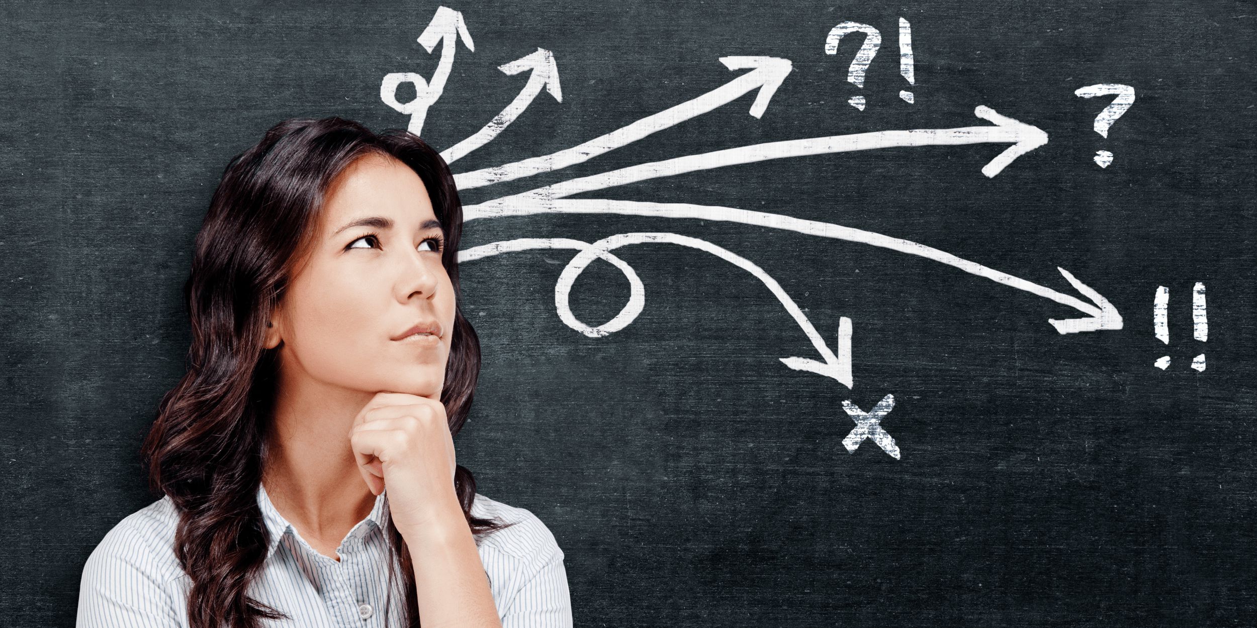 A pensive woman with dark, wavy hair looks up and to the left, with her chin resting on her clenched fist, against a dark chalkboard background. From behind her head, multiple white chalk arrows branch out in different directions across the chalkboard. Some arrows have question marks, an exclamation mark, or an 'X' at their ends, symbolizing various paths, uncertainties, or decisions. The image evokes a sense of deep thought, problem-solving, or navigating complex choices.